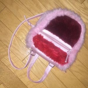 A mini fuzzy-cozy backpack